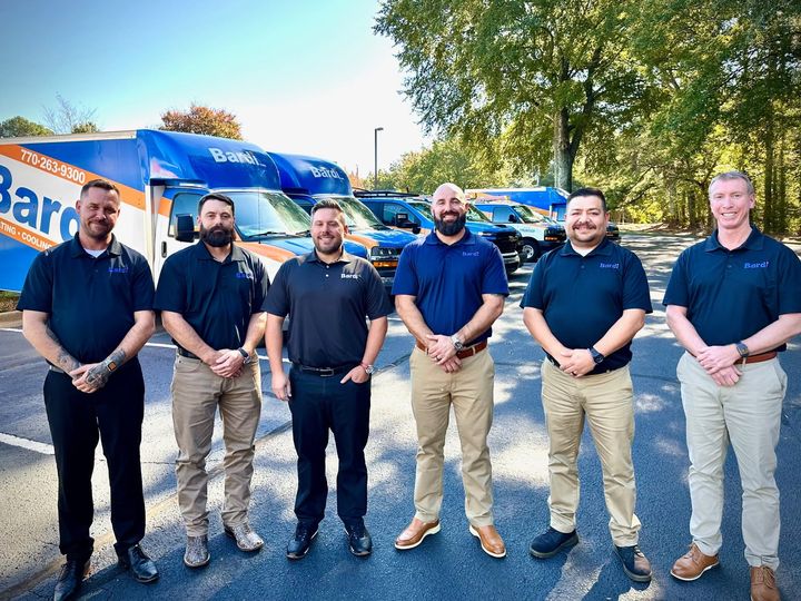 The Bardi Heating & Air team in front of their service fleet