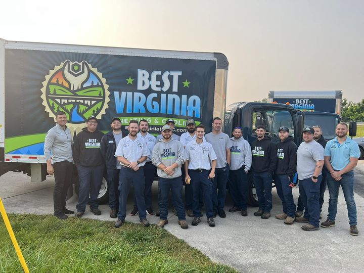 The Best Virginia Heating & Cooling team in front of their trucks