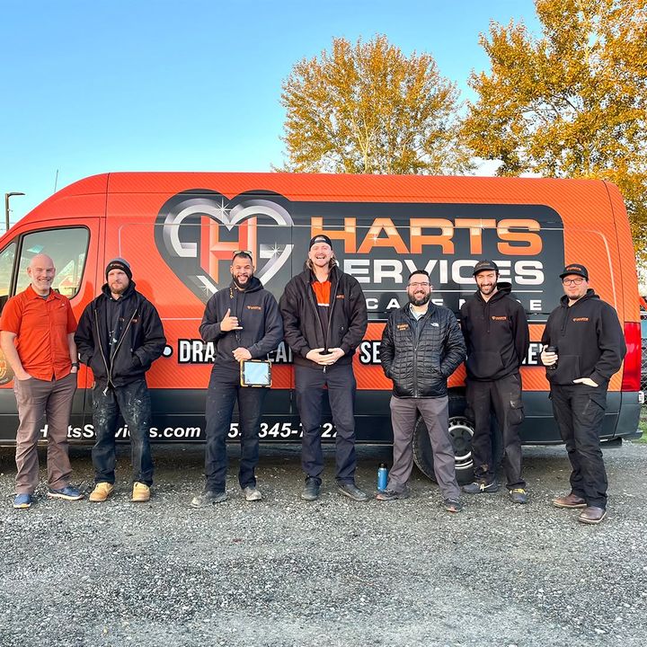 The HARTS Services crew in front of a company van